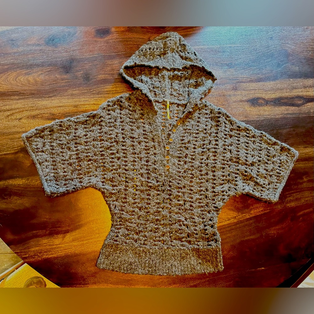 Free People small crocheted, hooded sweater. Fits like an extra small.